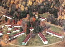 Aerial view of Camp Gibbs CCC-era buildings, set in autumn woods near Iron River, Michigan.