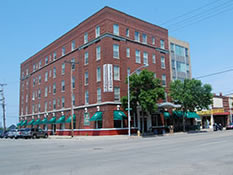  Five-story red brick Delta Hotel in Escanaba, now housing shops and apartments.