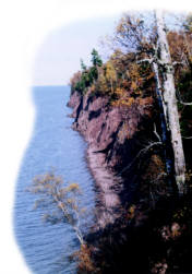  Steep, forested cliff along Lake Superior, site of 1600s Ojibwa-Fox battle near Madeline Island.