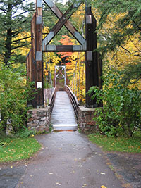  Wooden suspension footbridge on the historic Black River harbor trail.