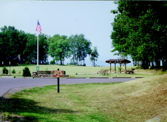  Picnic area with flag and gazebos at F.J. McLain State Park, near Lake Superior and copper relics.