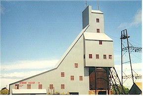  Tall metal Quincy Mine shafthouse, part of historic site offering underground tours and exhibits.