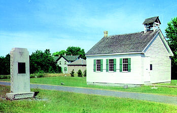Historic white one-room schoolhouse.