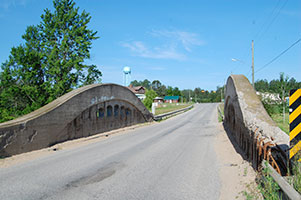 Historic concrete arch bridge spanning the Manistique River in Germfask, Michigan.