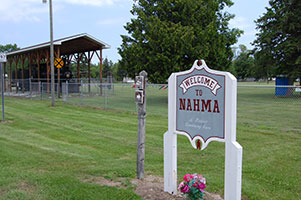 “Welcome to Nahma” sign near historic Locomotive No. 5.