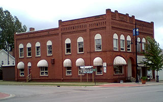 Red-brick Romanesque Revival bank building in Newberry, Michigan, built in 1890.