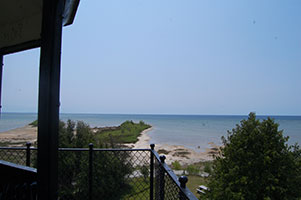  View of Lake Michigan shoreline and sandy point from Peninsula Point Light Station tower.
